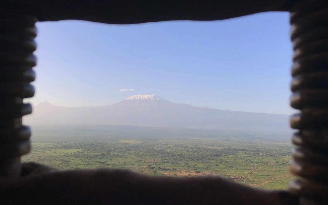 Image of the view of Mount Kilimanjaro from a window through the basket